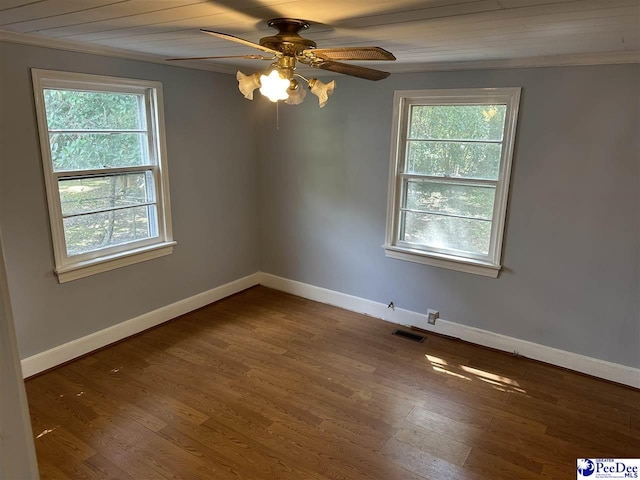 empty room featuring ceiling fan and dark hardwood / wood-style floors