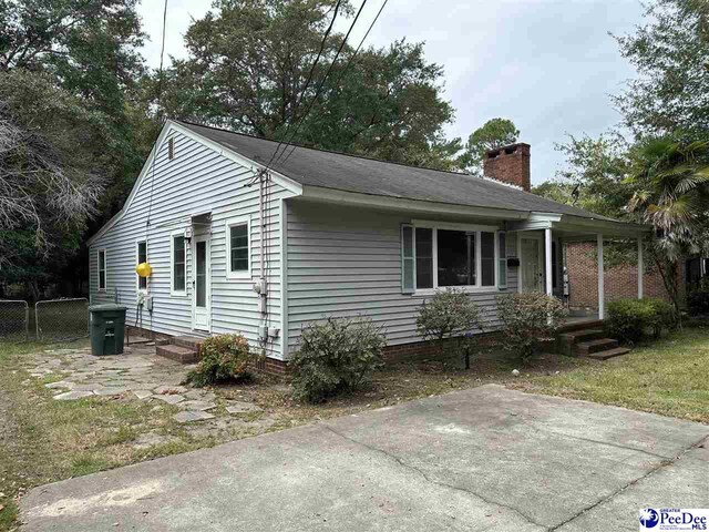 view of side of property featuring a patio