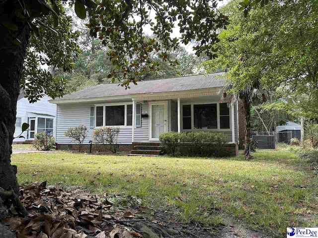 ranch-style house with a front lawn