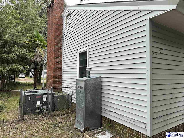 view of property exterior with central AC unit