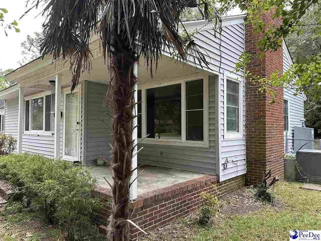 view of side of property featuring a patio