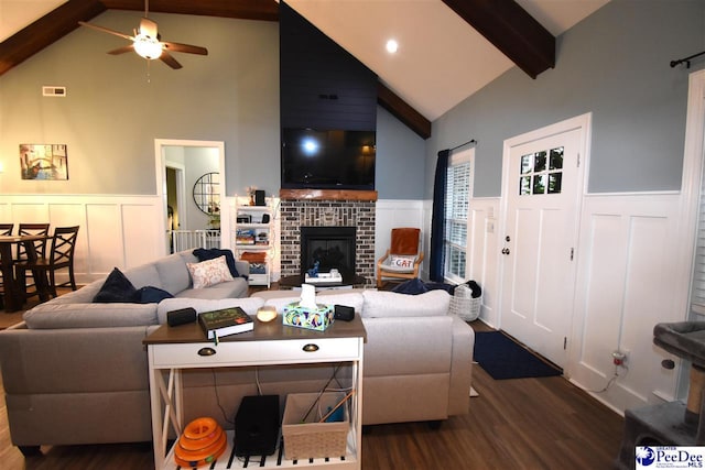 3804 Beckford St, Florence, SC 29501 - living room featuring dark wood-style floors, beamed ceiling, wainscoting, ceiling fan, and high vaulted ceiling