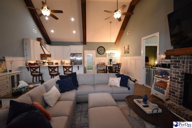 3804 Beckford St, Florence, SC 29501 - living room with a ceiling fan, high vaulted ceiling, wainscoting, beamed ceiling, and dark wood-style flooring