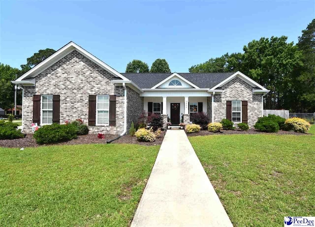 3804 Beckford St, Florence, SC 29501 - view of front facade featuring brick siding and covered porch