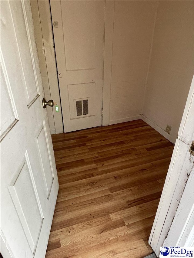 413 Kenwood Ave, Hartsville, SC 29550 - clothes washing area featuring visible vents and wood finished floors