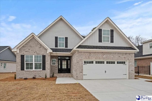 craftsman-style house with a garage and a front yard