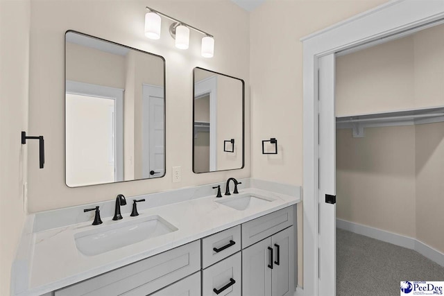 125 E Pine St, Florence, SC 29506 - bathroom featuring double vanity and baseboards