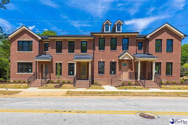 125 E Pine St, Florence, SC 29506 - townhome / multi-family property featuring brick siding