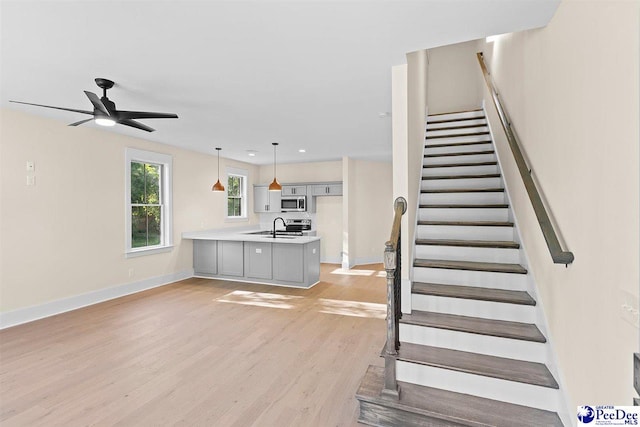 125 E Pine St, Florence, SC 29506 - stairs with wood finished floors and ceiling fan
