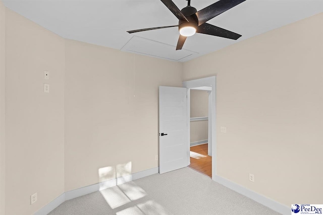 125 E Pine St, Florence, SC 29506 - carpeted empty room featuring attic access and a ceiling fan