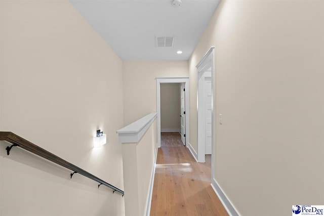 125 E Pine St, Florence, SC 29506 - hallway with an upstairs landing, light wood-style floors, and recessed lighting