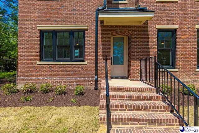125 E Pine St, Florence, SC 29506 - doorway to property with brick siding