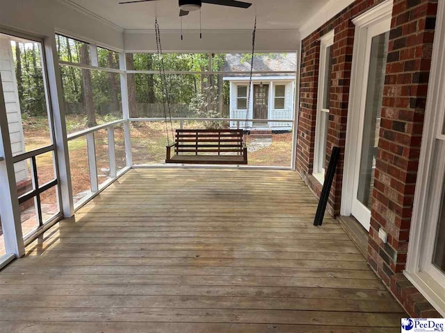 exterior space featuring a ceiling fan