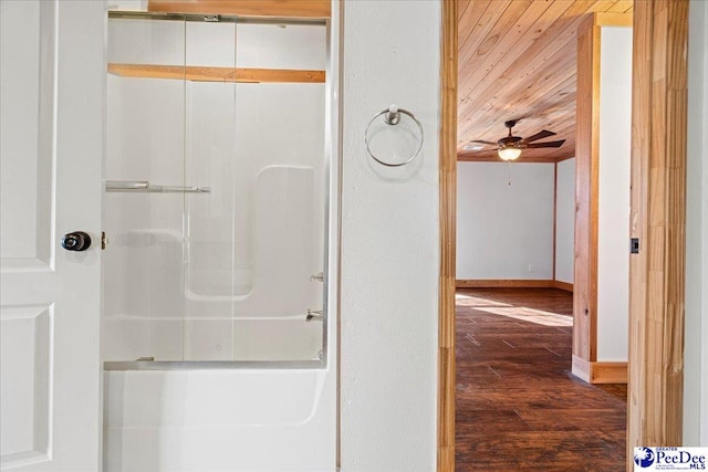 bathroom with baseboards, a shower, ceiling fan, wood ceiling, and wood finished floors