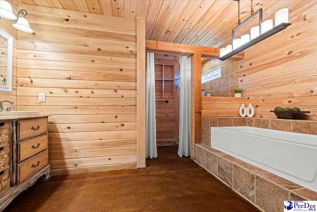 full bath with tiled bath, wooden ceiling, wood walls, and vanity