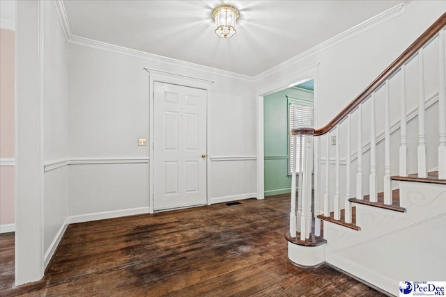 entrance foyer with baseboards, visible vents, dark wood-type flooring, stairs, and crown molding