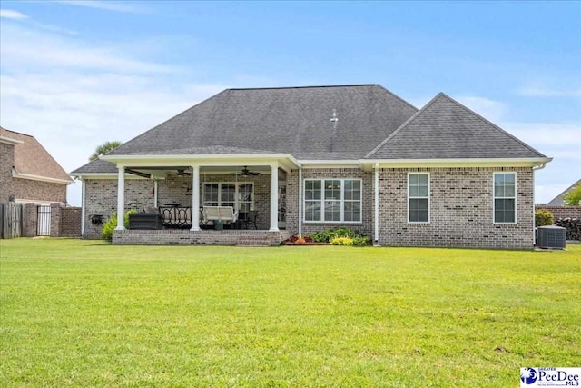 3111 Cheshire Ln, Florence, SC 29501 - rear view of property with a ceiling fan, brick siding, roof with shingles, cooling unit, and a patio area