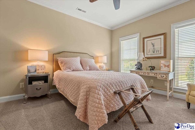 3111 Cheshire Ln, Florence, SC 29501 - bedroom featuring crown molding, multiple windows, light carpet, baseboards, and a ceiling fan
