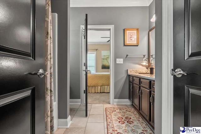 3111 Cheshire Ln, Florence, SC 29501 - full bath featuring vanity, baseboards, connected bathroom, tile patterned flooring, and ornamental molding