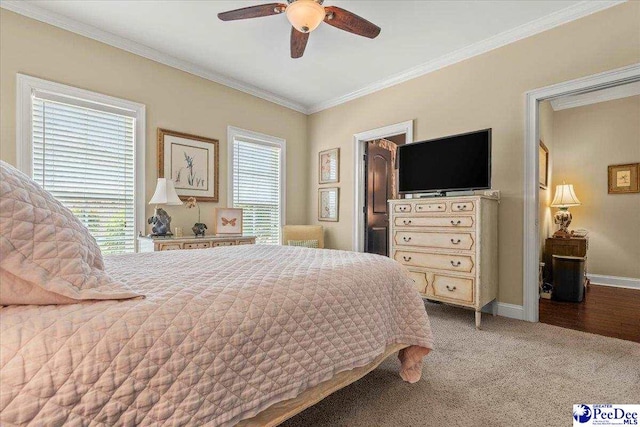 3111 Cheshire Ln, Florence, SC 29501 - carpeted bedroom featuring crown molding, baseboards, and a ceiling fan