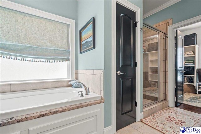 3111 Cheshire Ln, Florence, SC 29501 - full bathroom featuring a stall shower, a garden tub, and ornamental molding