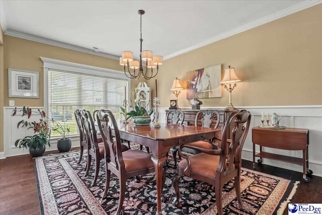 3111 Cheshire Ln, Florence, SC 29501 - dining area featuring a chandelier, crown molding, wood finished floors, and wainscoting