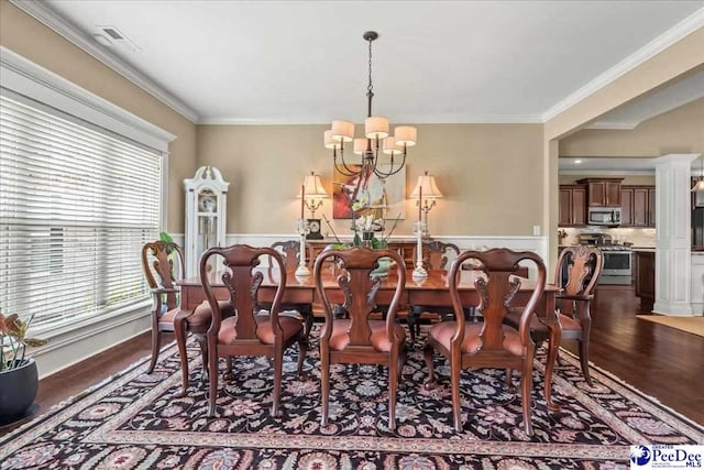 3111 Cheshire Ln, Florence, SC 29501 - dining room with plenty of natural light, a chandelier, crown molding, dark wood finished floors, and wainscoting