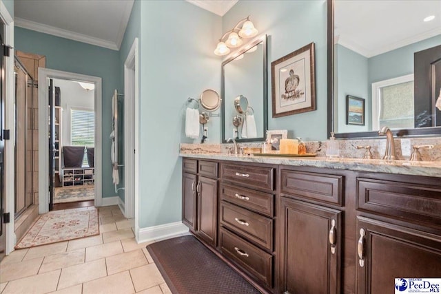 3111 Cheshire Ln, Florence, SC 29501 - bathroom featuring ornamental molding, double vanity, tile patterned flooring, and baseboards