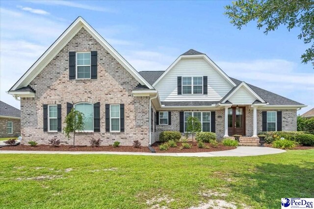 3111 Cheshire Ln, Florence, SC 29501 - view of front of property featuring brick siding and a front yard