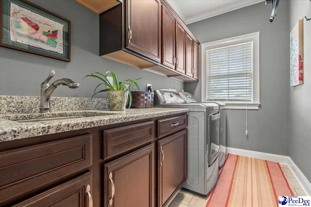 3111 Cheshire Ln, Florence, SC 29501 - laundry area with washing machine and clothes dryer, cabinet space, crown molding, baseboards, and light tile patterned floors