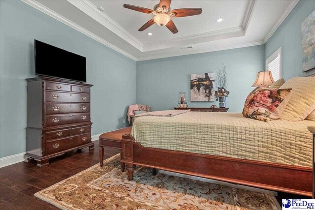3111 Cheshire Ln, Florence, SC 29501 - bedroom with wood finished floors, a tray ceiling, baseboards, crown molding, and a ceiling fan