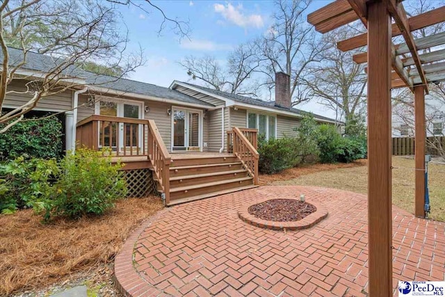 back of house with a patio, a deck, and a pergola