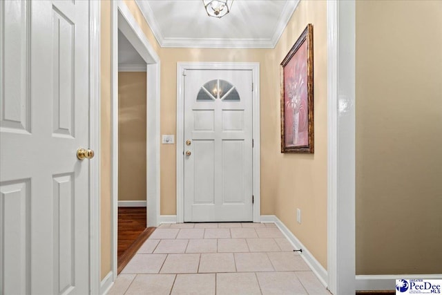 entryway featuring light tile patterned floors and ornamental molding