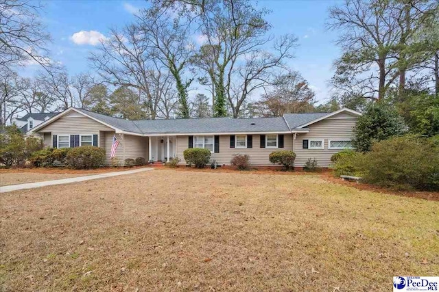 ranch-style house featuring a front lawn