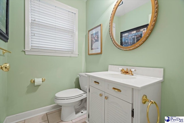 bathroom with vanity, toilet, and tile patterned flooring