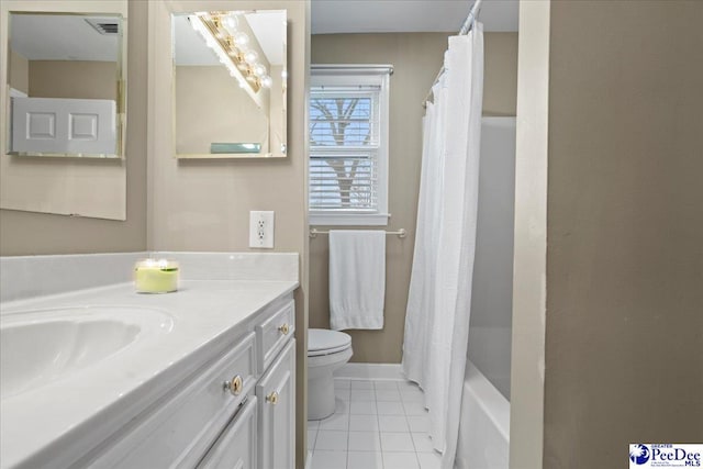 full bathroom with shower / tub combo with curtain, tile patterned floors, toilet, and vanity