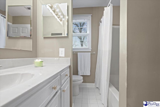 full bathroom with shower / tub combo with curtain, vanity, toilet, and tile patterned flooring