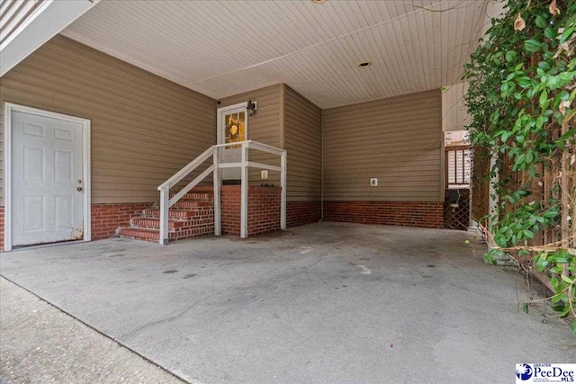 view of patio / terrace with a carport