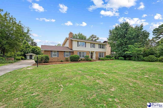 1110 Dunvegan Rd, Florence, SC 29501 - colonial inspired home featuring brick siding, a chimney, a front yard, and concrete driveway