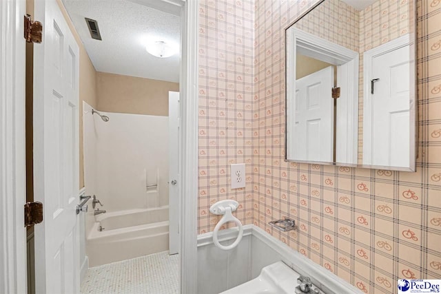 1110 Dunvegan Rd, Florence, SC 29501 - full bathroom with shower / tub combination, wallpapered walls, tile patterned floors, and a textured ceiling