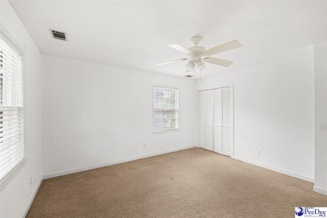1110 Dunvegan Rd, Florence, SC 29501 - spare room featuring carpet flooring and a ceiling fan