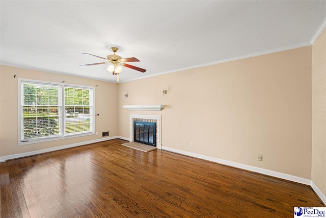 1110 Dunvegan Rd, Florence, SC 29501 - unfurnished living room featuring ceiling fan, wood finished floors, a fireplace, and ornamental molding