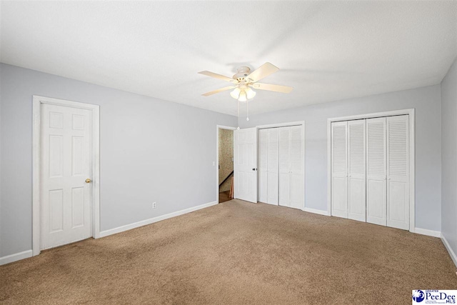1110 Dunvegan Rd, Florence, SC 29501 - unfurnished bedroom featuring carpet flooring, multiple closets, and ceiling fan