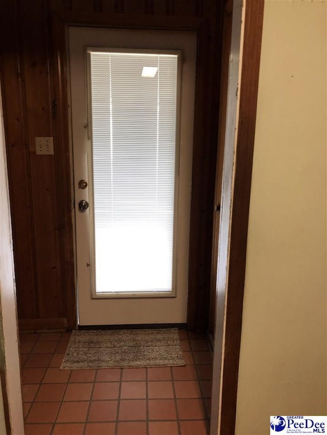 doorway featuring light tile patterned floors