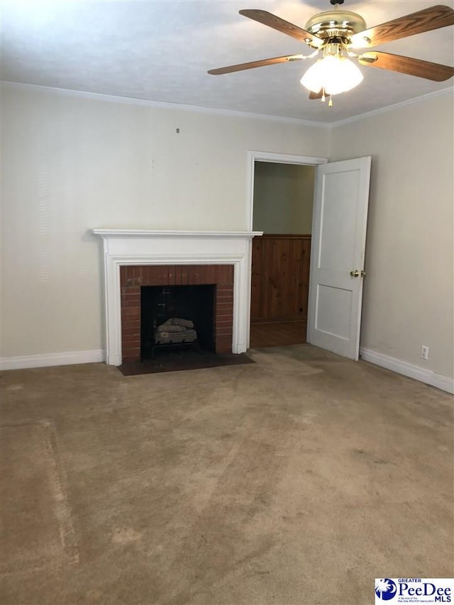 unfurnished living room featuring baseboards, carpet floors, a brick fireplace, and crown molding