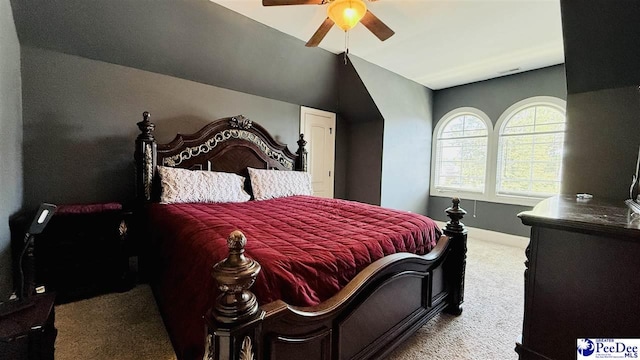 bedroom with lofted ceiling, carpet floors, and ceiling fan