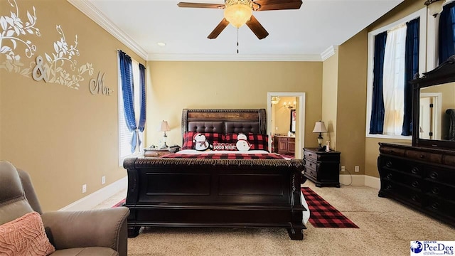 bedroom featuring ornamental molding, light colored carpet, and ceiling fan