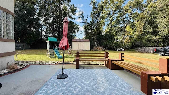 view of patio featuring a shed and a playground