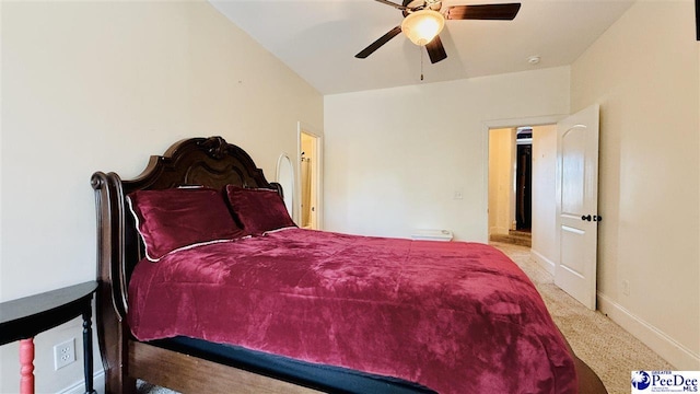 bedroom with light carpet and ceiling fan