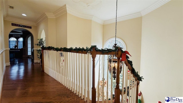 hall featuring crown molding and dark hardwood / wood-style flooring